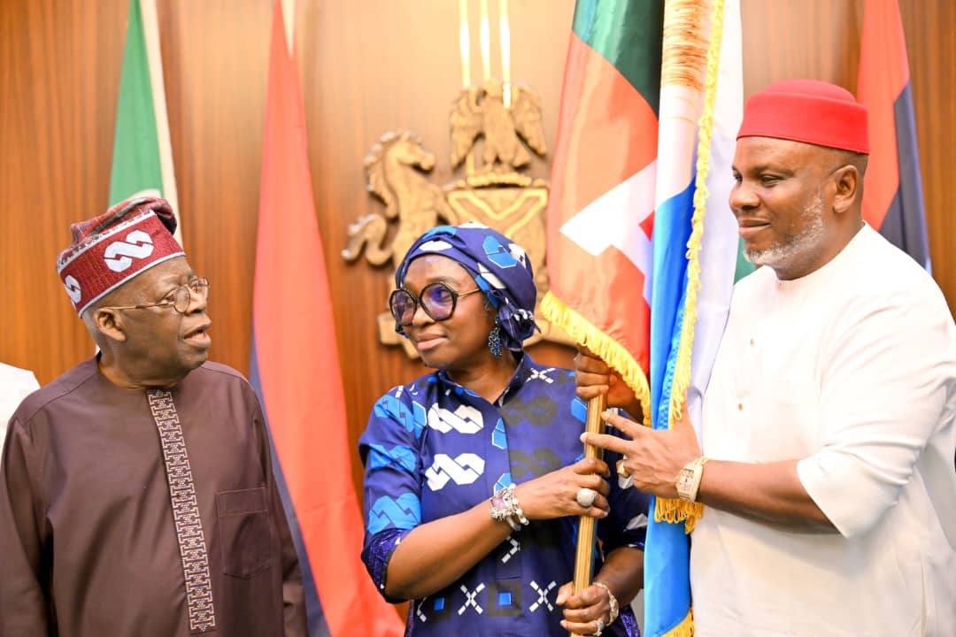 Read more about the article Go and Secure Anambra for APC — Tinubu Charges Ukachukwu, Presents Party Flag